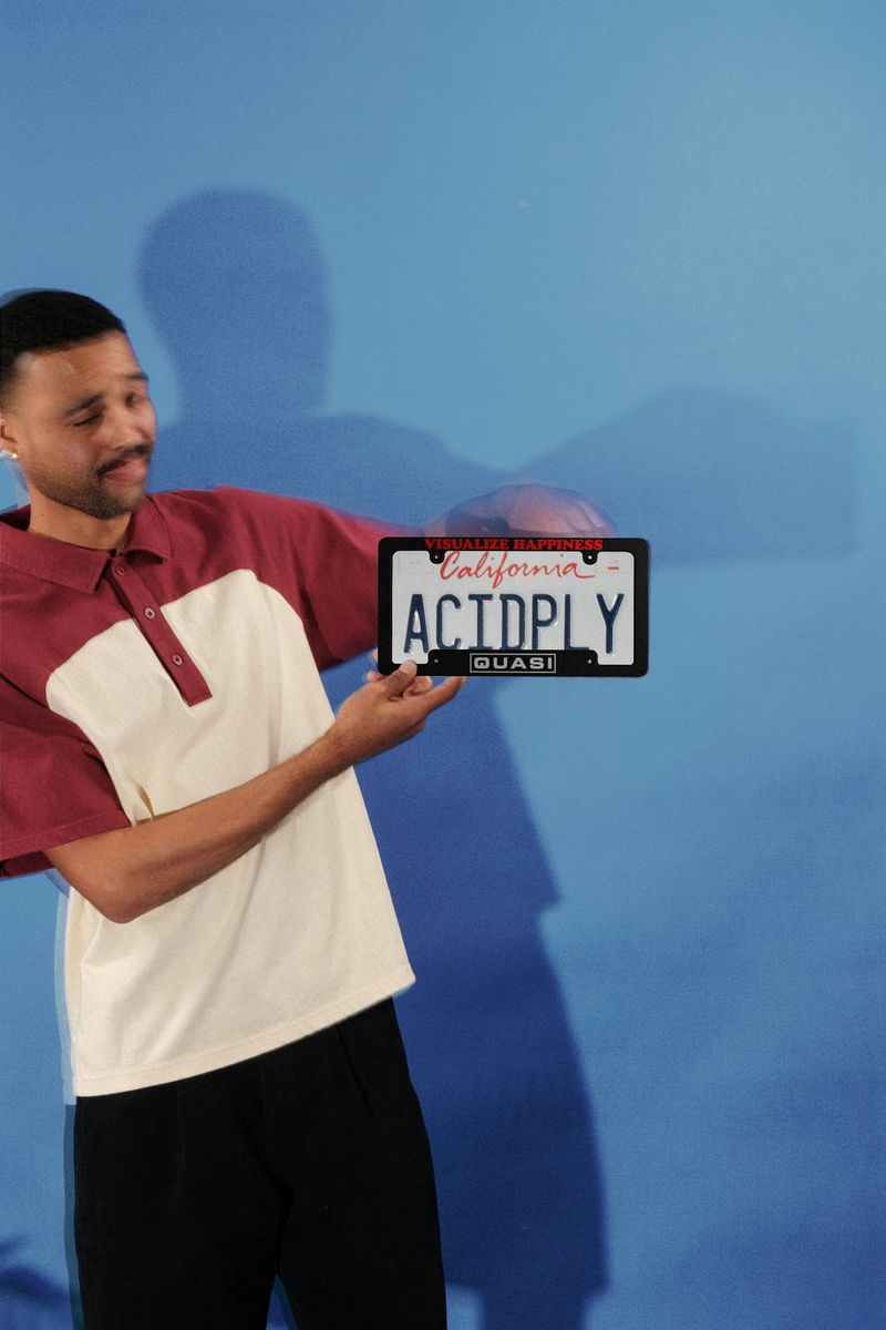Quasi Happiness License Plate Frame