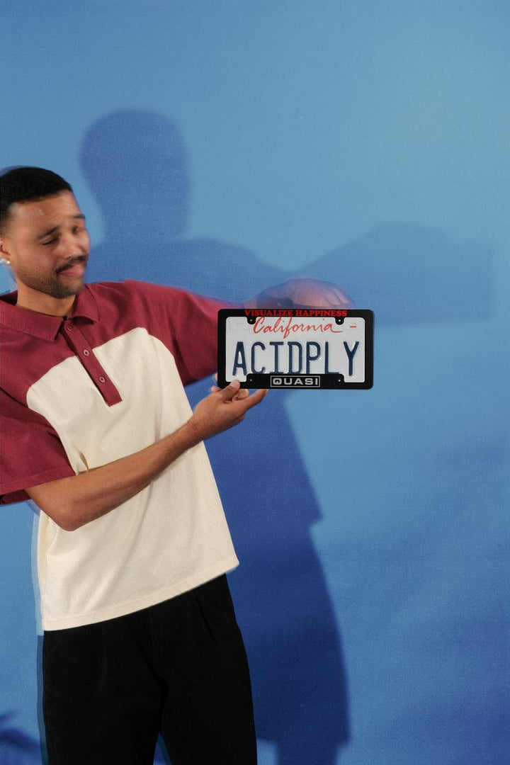 Quasi Happiness License Plate Frame